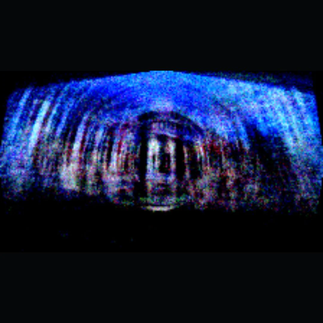 A blue responsive projection forming an immersive architectural image field.