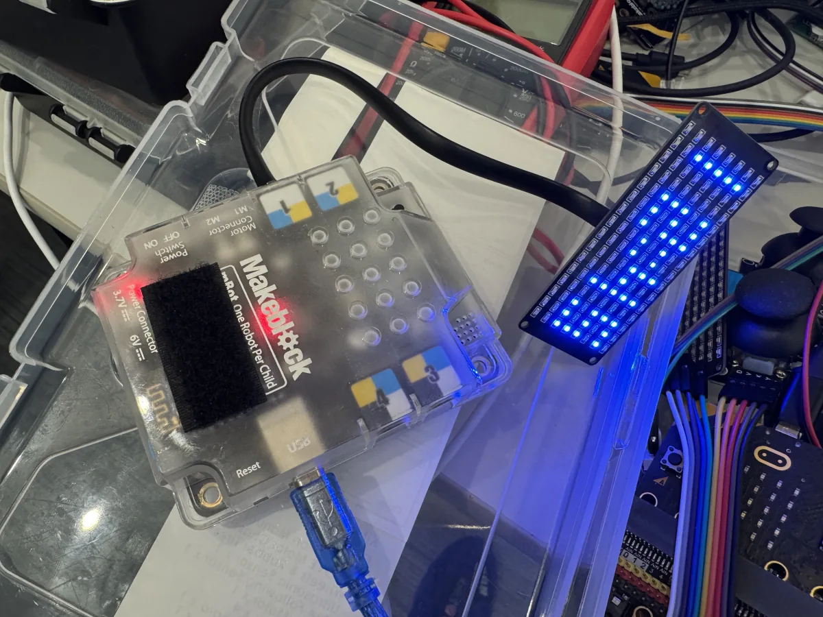 Physical-computing hardware with illuminated LED matrix.
